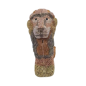 Detailed view of the monkey-shaped evening clutch with champagne and brown crystals
