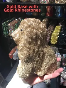 Detailed close-up of a luxury lion shaped evening clutch bag with gold crystals