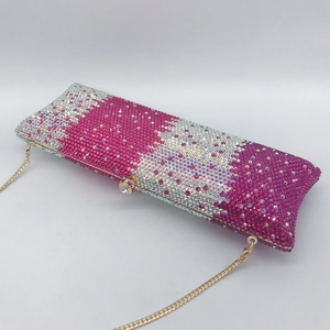 Macro shot of pink and silver rhinestones with golden metal trim and crystal clasp