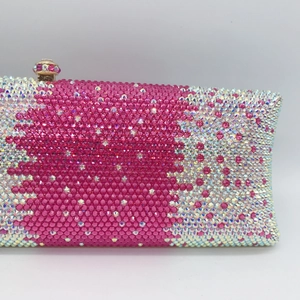 Detailed close-up of pink and silver rhinestones on the luxury clutch evening bag
