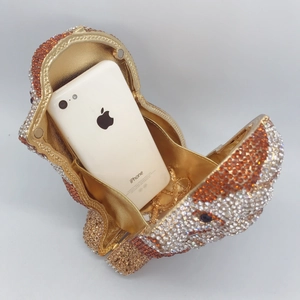 Internal view of hippo rhinestone clutch showing capacity for an iPhone and chain strap