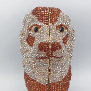 Macro shot of lion head evening bag showing sparkling rhinestones and crystal eyes