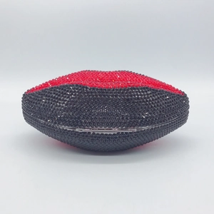 Detailed close-up of lip-shaped evening clutch with red and black crystal rhinestones