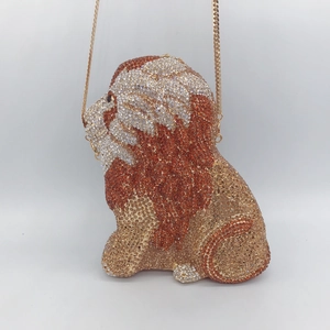 Detailed view of luxury lion-shaped evening clutch with sparkling crystal rhinestones