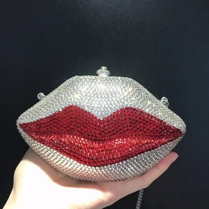 Macro shot of red and silver rhinestones on the lip-shaped evening clutch bag