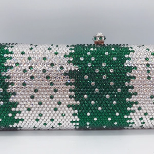 Close-up of green and white handmade rhinestones on a rectangular evening clutch bag