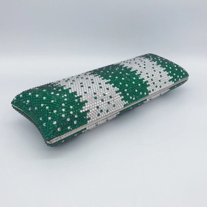Detail view of the green and silver crystal rhinestones on this luxury evening clutch bag