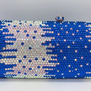 Close-up of royal blue and silver rhinestones on luxury evening clutch bag detail