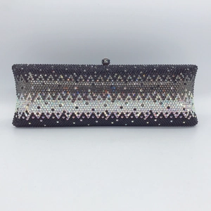 Close-up of rectangle evening clutch with black and silver gradient crystal rhinestones