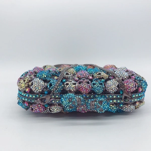 Exquisite skull pattern clutch bag with colorful rhinestones and metallic chain