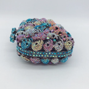Luxury heart-shaped clutch bag with colorful gradient crystals and hollow metal frame