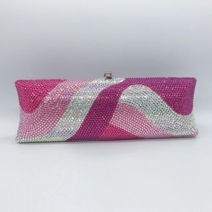 Macro detail of wave pattern colorful rhinestones on evening clutch bag shell