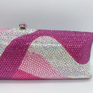 Detailed view of pink gradient wave pattern rhinestone clutch bag with crystal metal clasp