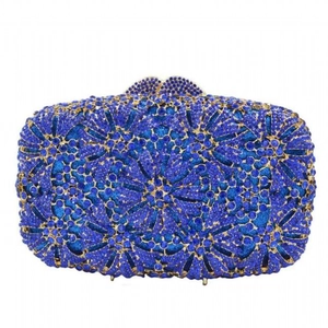 Detailed view of floral blue crystal pattern and metal clasp on luxury evening clutch bag