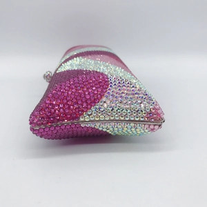 Close-up of pink and silver rhinestone diagonal pattern on luxury dinner clutch bag