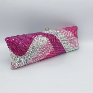 Detail of pink and white wave-patterned rhinestones on a rectangular evening clutch bag