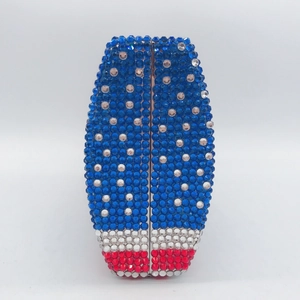 Close-up of stripes evening clutch with red white blue rhinestones and metal frame