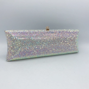 Macro shot of colorful AB rhinestones and gold metal clasp on the long evening clutch bag