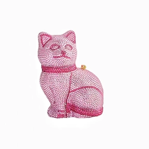 Detailed view of pink crystal rhinestones on a cat-shaped evening clutch bag