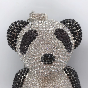 Macro shot of a panda-shaped keychain featuring sparkling black and white rhinestones