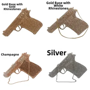 Detail view of four gun-shaped crystal evening bags with metal chains in assorted colors
