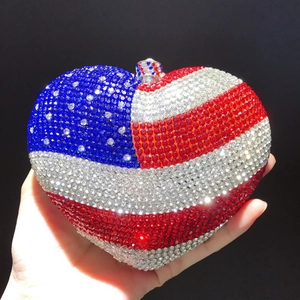 Sparkling heart-shaped evening clutch featuring a crystal-encrusted American flag design
