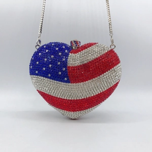Heart-shaped clutch bag with American flag crystal embellishments and silver chain strap