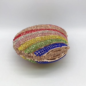 Detailed view of rainbow rhinestone encrusted clutch bag with elegant golden metal frame