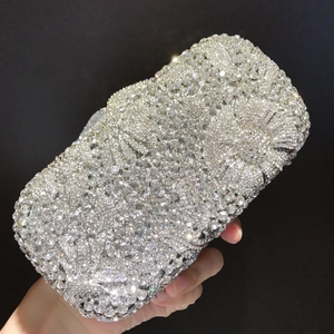 Detailed view of silver crystal floral evening clutch with luxury diamond embellishments