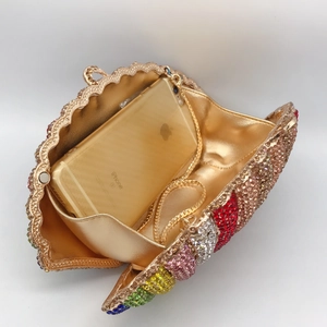 Interior view of colorful rhinestone clutch showing space for a smartphone and chain