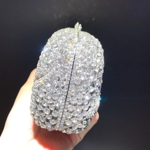 Close-up of sparkling floral diamond dinner clutch bag with full rhinestone embellishment