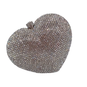 Sparkling heart shaped evening clutch bag with silver crystals and a metal frame