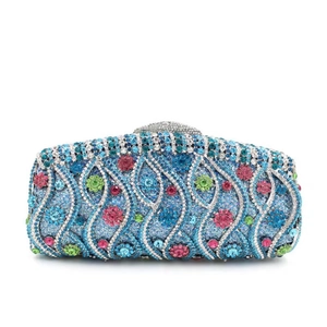 Detailed macro of crystal evening clutch with colorful floral rhinestone patterns