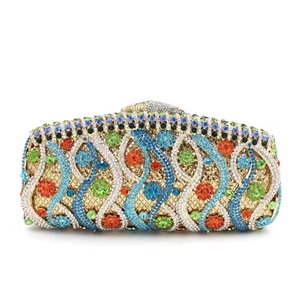 Detailed close-up of intricate gold metal grid with colorful rhinestones on a luxury evening bag