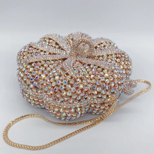 Luxury pumpkin shaped evening bag fully embellished with shimmering crystals and gold chain