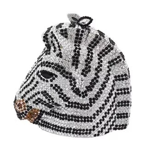 Macro shot of 3D zebra clutch bag featuring dense rhinestone embellishment details