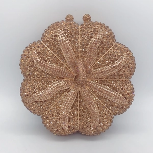 Luxury champagne gold pumpkin shaped evening bag fully embellished with sparkling rhinestones