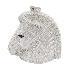 Macro detail of horse-shaped evening bag with sparkling crystal embellishments