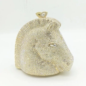 Detailed close-up of a horse head evening clutch bag encrusted with white crystals