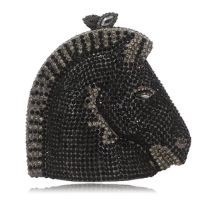 Detailed view of horse head clutch bag encrusted with black and grey gradient crystals