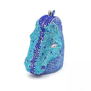 Detailed view of horse head evening clutch bag featuring blue crystal embellishments