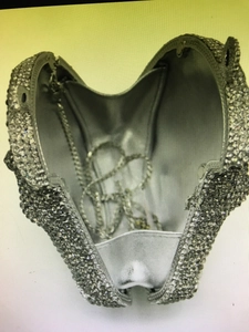 Detail of silver rhinestone evening bag showing satin lining and detachable chain