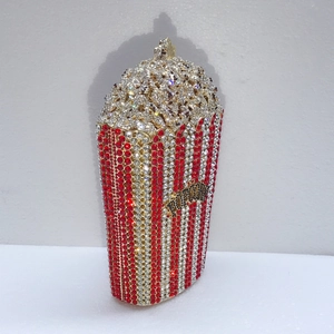 Detailed macro view of red and white rhinestones on the popcorn shaped evening bag