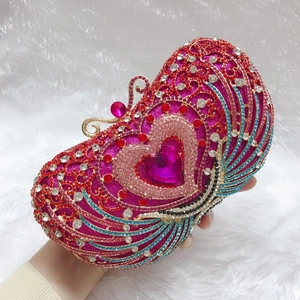 Luxurious heart-shaped evening clutch bag with colorful rhinestones and gold clasp