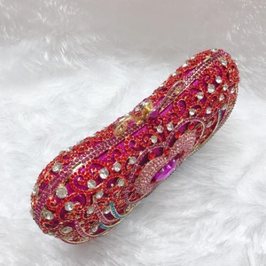 Macro shot of luxury crystal evening clutch featuring intricate floral rhinestone patterns