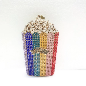 Detailed view of luxury popcorn-shaped clutch bag with colorful rhinestones and metal lock