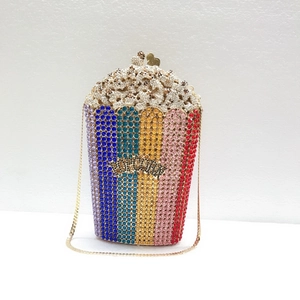 Detailed macro of the handmade popcorn clutch bag with multicolor rhinestones and gold chain