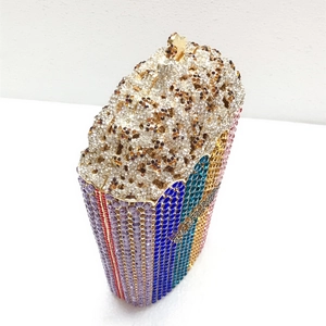 Detailed view of the luxury popcorn-shaped evening clutch with colorful striped rhinestones