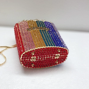Detailed macro view of colorful rhinestone popcorn clutch bag with gold chain strap