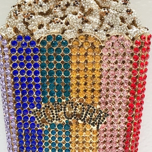 Detailed close-up of a luxury popcorn shaped evening clutch bag with colorful crystals